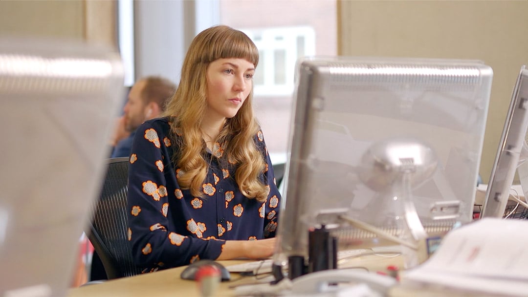 Woman working at a computer
